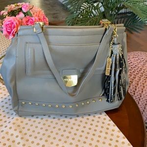 Steve Madden gray bag. Gold studded. Tassel is removable.